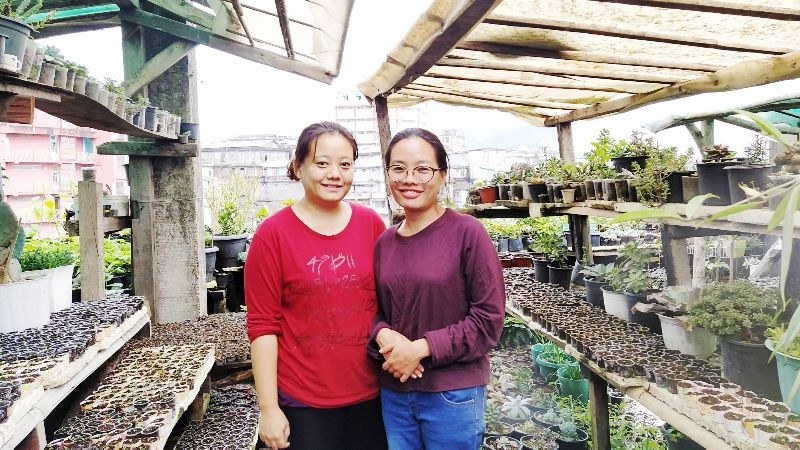 (L) Marina Kulnu & (R) Mary Kulnu seen in their rooftop terrace flower nursery in Kohima.